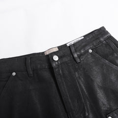 Gallery Dept Denim Shorts Black waxed-finish work pants featuring paneled denim detailing at the knees—a versatile, high-street style piece.