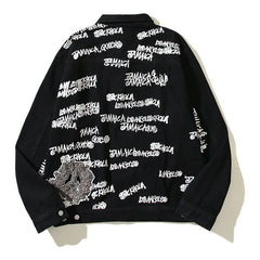 American-style baseball jacket Stu x Tears American High-Street Collaboration: Denim Jacket Featuring All-Over Barrage Text Print and Embroidered Cotton Boll Motifs.
