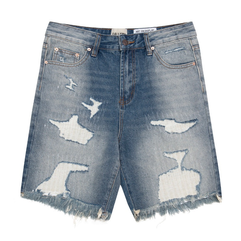Gallery Dept Denim Shorts Distressed denim shorts with patches, rips, and frayed hems—casual style.