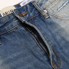 Gallery Dept Denim Shorts Distressed denim shorts with patches, rips, and frayed hems—casual style.