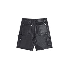 Gallery Dept Denim Shorts Black waxed-finish work pants featuring paneled denim detailing at the knees—a versatile, high-street style piece.