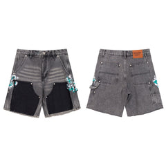 Gallery Dept Denim Shorts Street-style casual shorts featuring a mix of styles—including paint-splatter and woodcutter-inspired paneling—crafted from washed denim. Versatile and trendy.